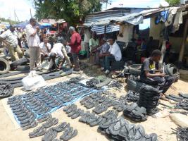 Cobblers producing slippers from old tyres / Tanzania